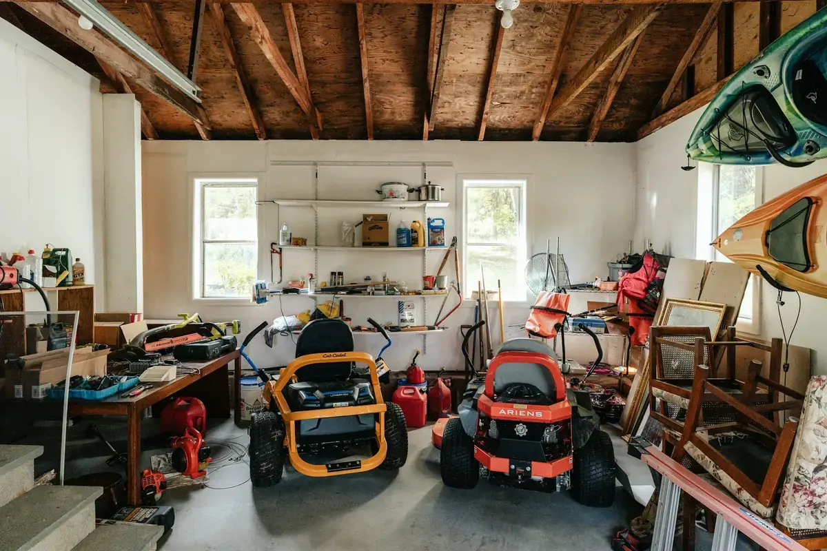Garage full of items before a junk removal cleanout