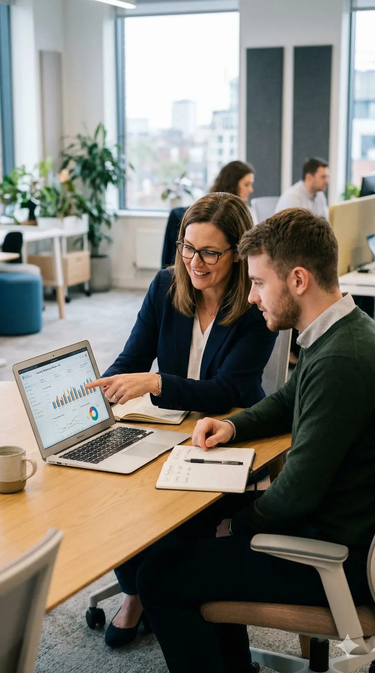 Hiring manager and recruiter reviewing candidates together